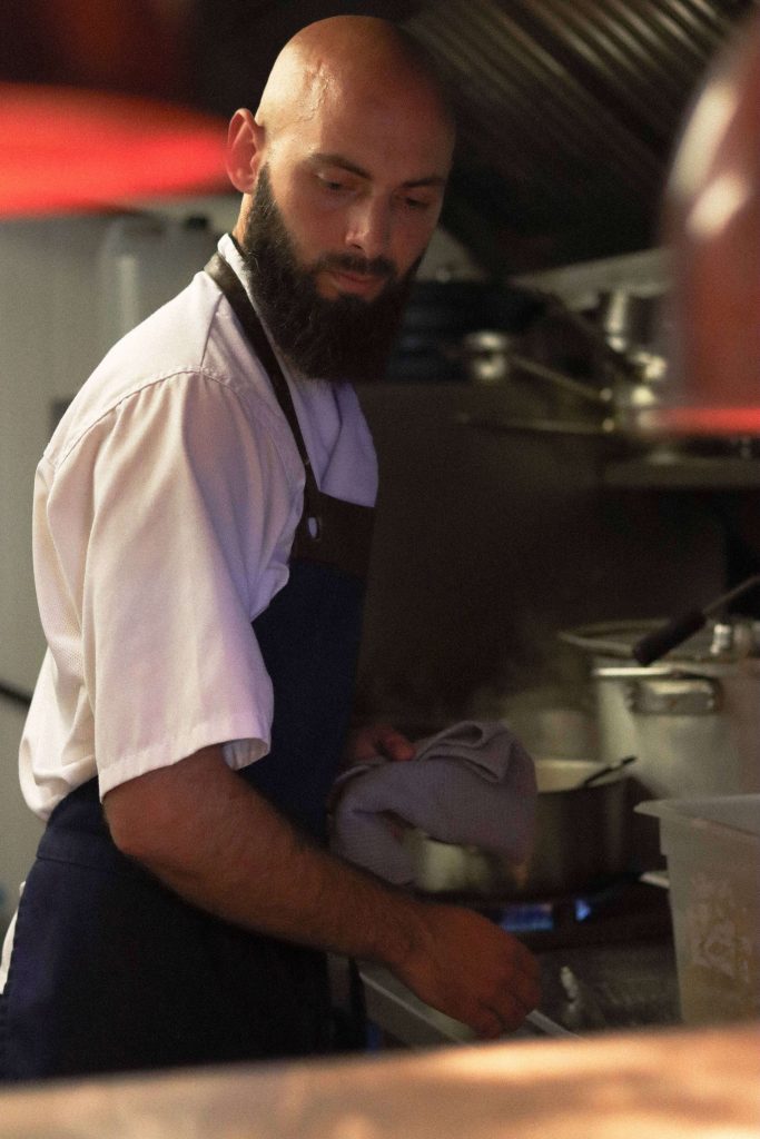 Head chef in kitchen area of The Bull Freehouse pub in Suffolk